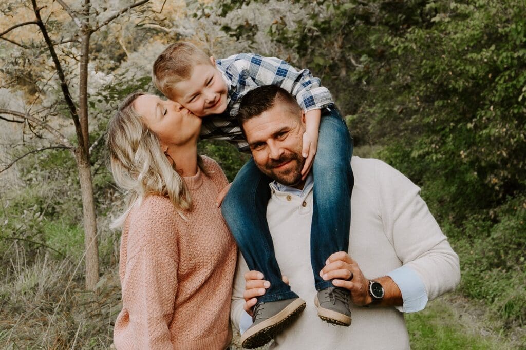Family photo of a man, woman, and son. They are franchise owners.