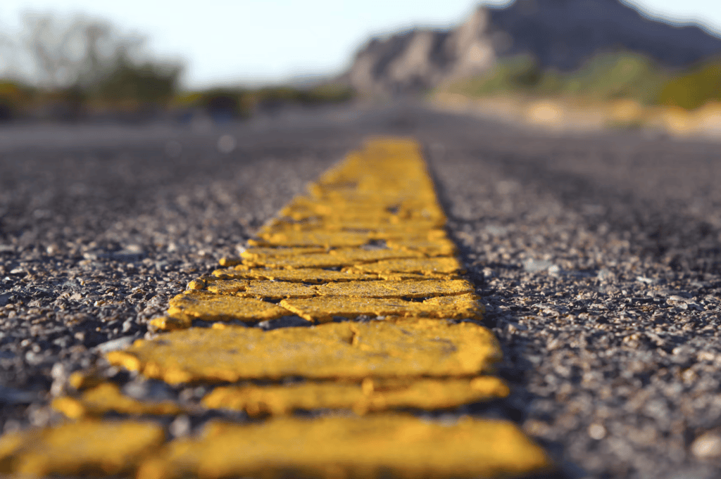 Paving line on road to demonstrate what EverLine Coatings franchise does